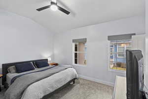 Bedroom with vaulted ceiling and ceiling fan