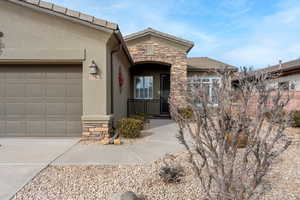 Property entrance featuring a garage