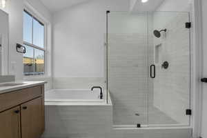 Bathroom with vanity and plus walk in shower