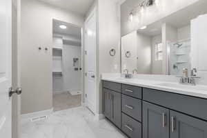 Bathroom with vanity and walk in shower