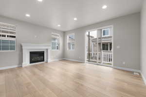 Unfurnished living room with light hardwood / wood-style flooring