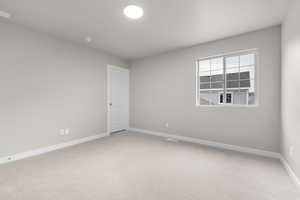 Empty room with carpet floors