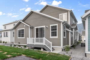 View of back of property featuring a front lawn