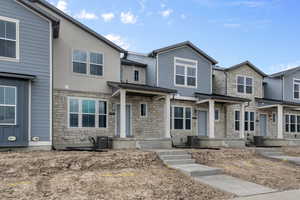 View of front of home with cooling unit