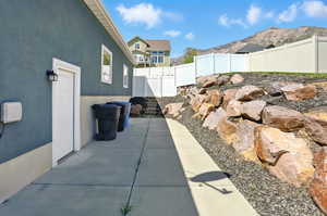 Fenced backyard with a patio and a mountain view