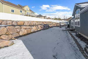 Yard covered in snow with a mountain view