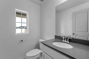 Bathroom with vanity and toilet