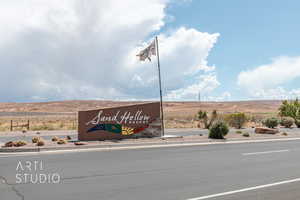 Community / neighborhood sign featuring a mountain view