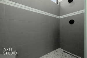 Bathroom featuring tiled shower