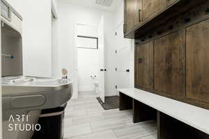 Bathroom with tile patterned floors and toilet