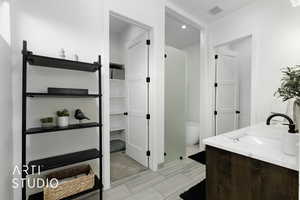 Bathroom with vanity and a tub