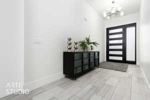 Foyer entrance featuring an inviting chandelier