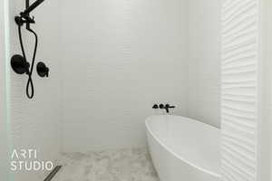 Bathroom featuring tiled shower