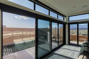 Doorway to outside with a mountain view