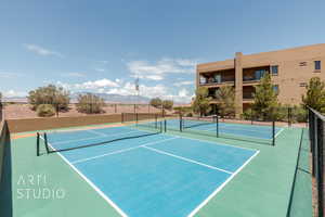 View of tennis court featuring a mountain view and basketball court