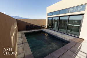 View of pool featuring a mountain view and a patio area