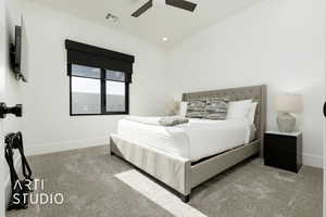 Carpeted bedroom with ceiling fan