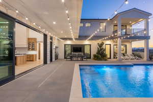 View of pool featuring a patio and area for grilling