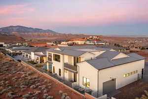 Aerial view at dusk featuring a mountain view