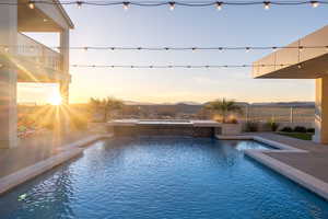 View of pool at dusk