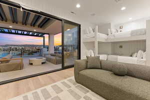 Bedroom featuring access to outside and hardwood / wood-style flooring