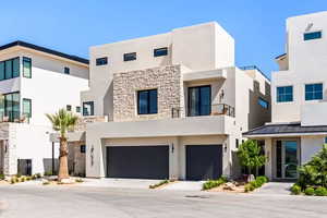 View of front of property featuring a garage