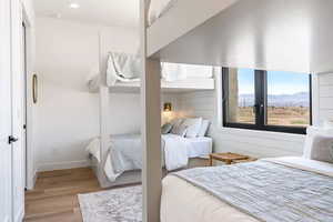 Bedroom featuring a mountain view and light hardwood / wood-style floors