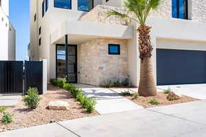 View of front facade featuring a garage