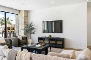 Living room with light wood-type flooring