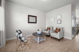 Sitting room featuring light wood-type flooring