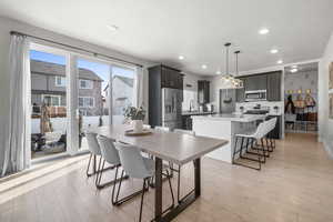 Dining area featuring sink and light hardwood / wood-style floors