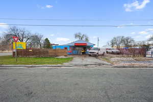 View of front of property with a front yard