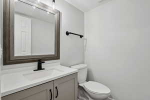 Bathroom featuring vanity and toilet