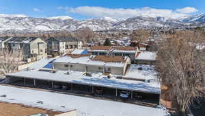 Snowy aerial view featuring a mountain view