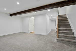 Basement with light carpet