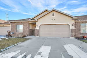 Ranch-style house featuring a garage