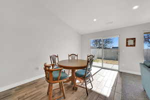 Dining room featuring vaulted ceiling