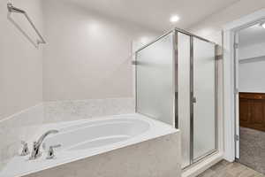 Bathroom featuring separate shower and tub