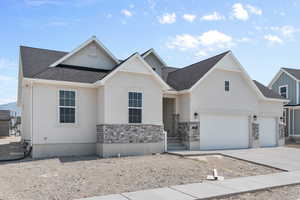 View of front facade featuring a garage