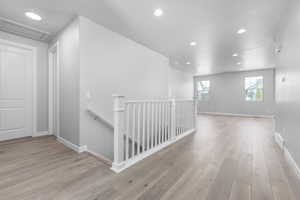 Hallway featuring light wood-type flooring