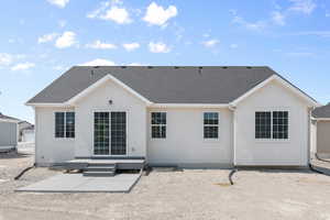 Rear view of house with a patio