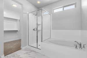 Bathroom with shower with separate bathtub