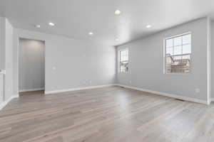 Unfurnished room with light hardwood / wood-style flooring