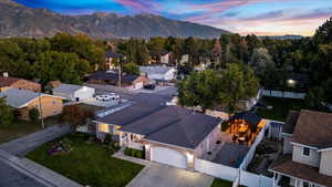 Aerial view at dusk featuring a mountain view