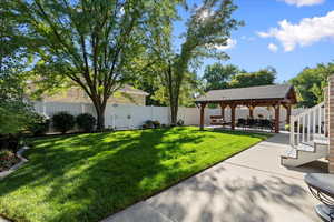 View of yard with a gazebo and a patio