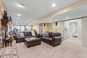 Carpeted living room featuring a fireplace