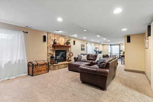 Carpeted living room featuring a fireplace