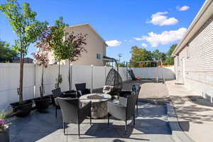 View of patio featuring an outdoor fire pit