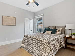 Bedroom with light wood-style flooring and ceiling fan