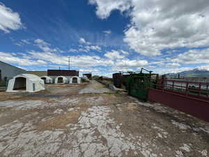 View of yard with a mountain view and an outbuilding